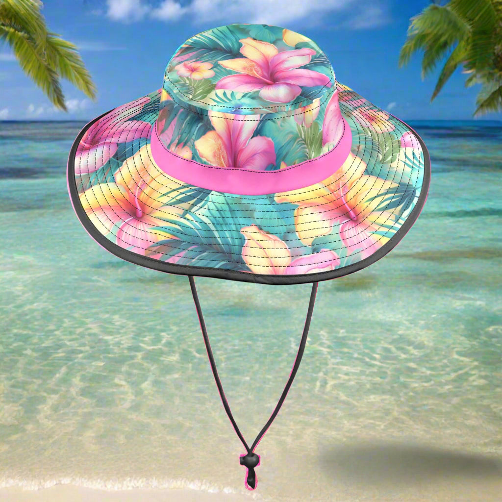 Colorful floral bucket hat with a pink band on a beachy background