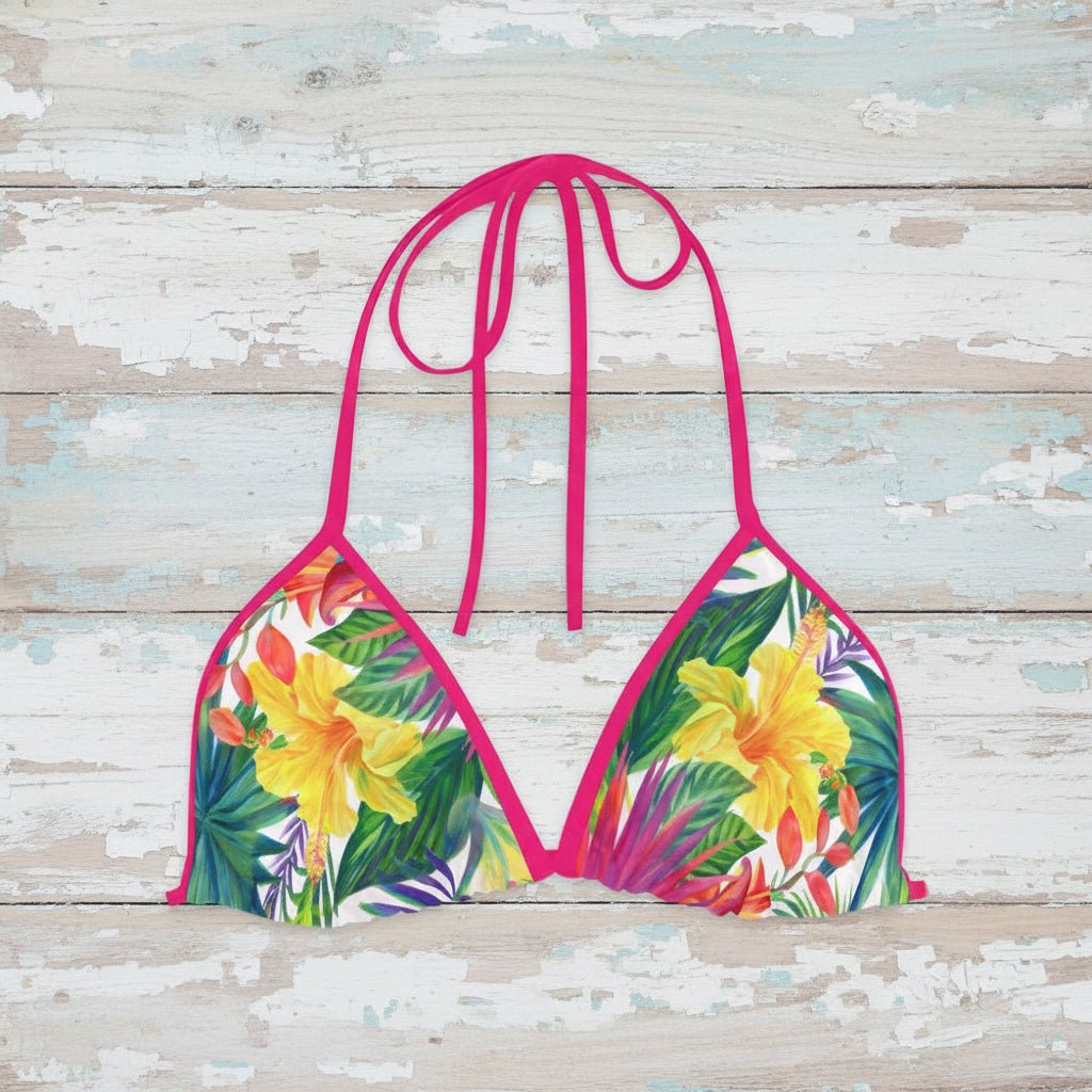 Colorful tropical floral bikini top on a rustic wood background