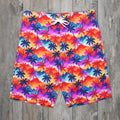 Colorful tropical patterned shorts with vintage Hawaiian style palm tree pattern