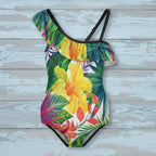 Colorful tropical floral swimsuit on a rustic wood background