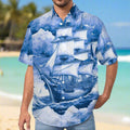 Man wearing a blue ship-themed Hawaiian shirt on Waikiki Beach