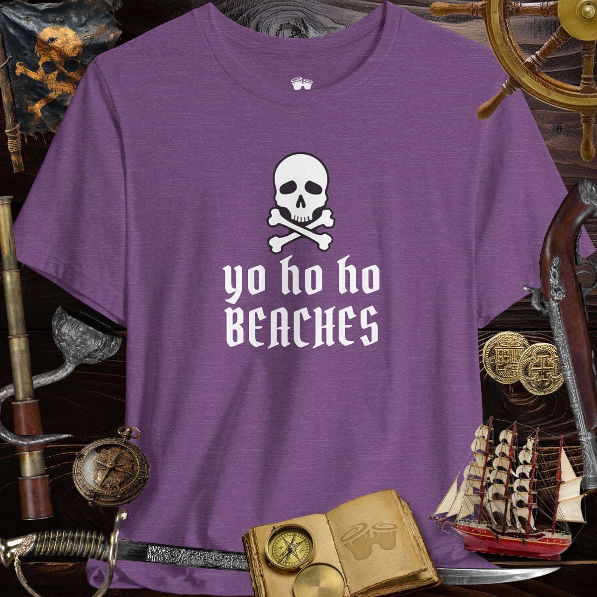 Yo Ho Ho Beaches Jolly Roger Pirate unisex tee displayed with pirate-themed accessories.