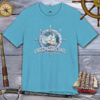 Blue t-shirt with United States Navy 250th Anniversary design on a wooden background with nautical items.