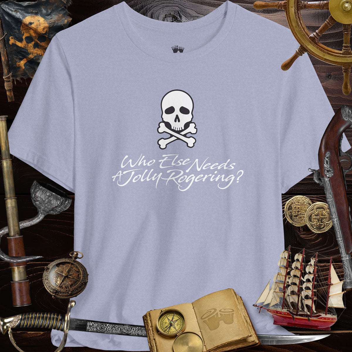 Funny Pirate Tee featuring skull and crossbones design, text: Who Else Needs A Jolly Rogering?, perfect for themed parties.
