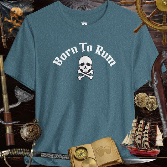 Born to Rum Jolly Roger Pirate Skull design on a casual Bella Canvas T-Shirt surrounded by pirate-themed props.