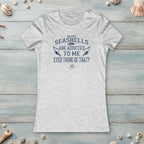 Ash gray t-shirt with words: Maybe Seashells are Addicted To Me Ever Think of That? on a nautical wood background