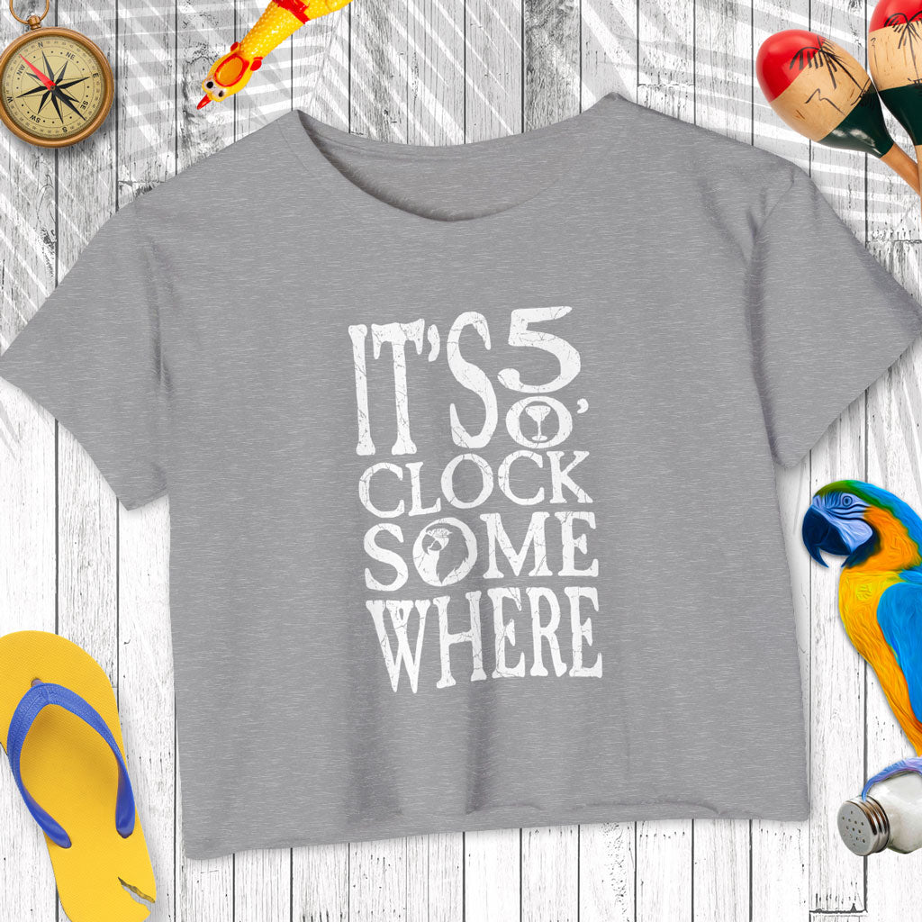 Gray t-shirt with 'It's 5 o'clock somewhere' text on a wooden background