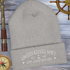 Gray beanie with 'United States Navy 250th Anniversary' text on a nautical-themed background.