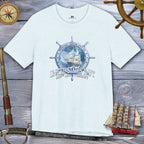 White t-shirt with United States Navy design on a wooden background with nautical items.
