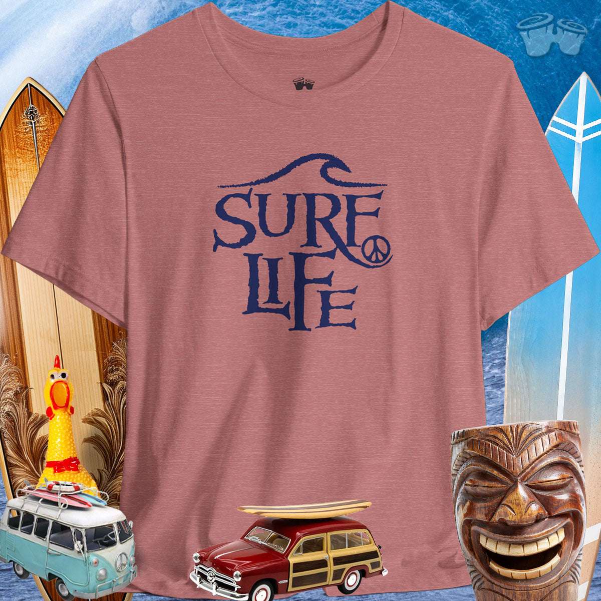 Surfer Life Tee featuring a wave design, ideal for beach lovers and surf enthusiasts, with vintage surf decor in the background.