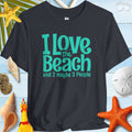 I Love The Beach Clever T-Shirt on beach background with shells, perfect for beach lovers and fun outings.
