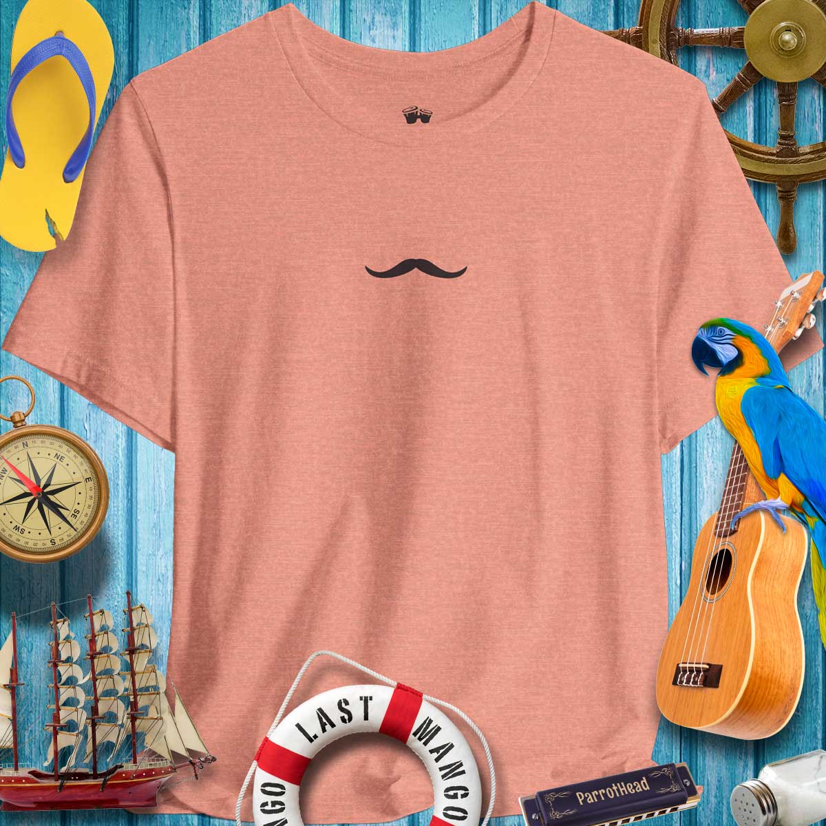 Pencil Thin Mustache T-Shirt with minimalist design, perfect for ParrotHeads and casual wear, surrounded by beach-themed decor.