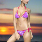 Model in Hot Pink Hawaiian style bikini standing on the beach