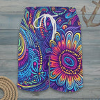 Colorful patterned shorts with a drawstring on a nautical wood background