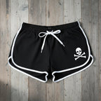Black shorts with a skull and crossbones design on a white background