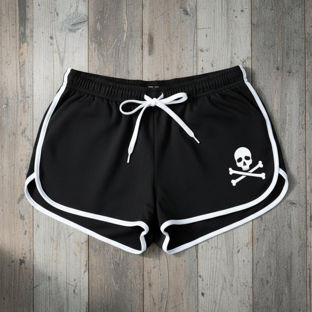 Black shorts with a skull and crossbones design on a white background