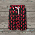 Black shorts with red skull and crossbones pattern on a nautical wood background