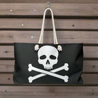 A Jolly Roger Skull and Crossbones Pirate flag Tote Bag hanging on a hook on the bulkhead of a pirate ship