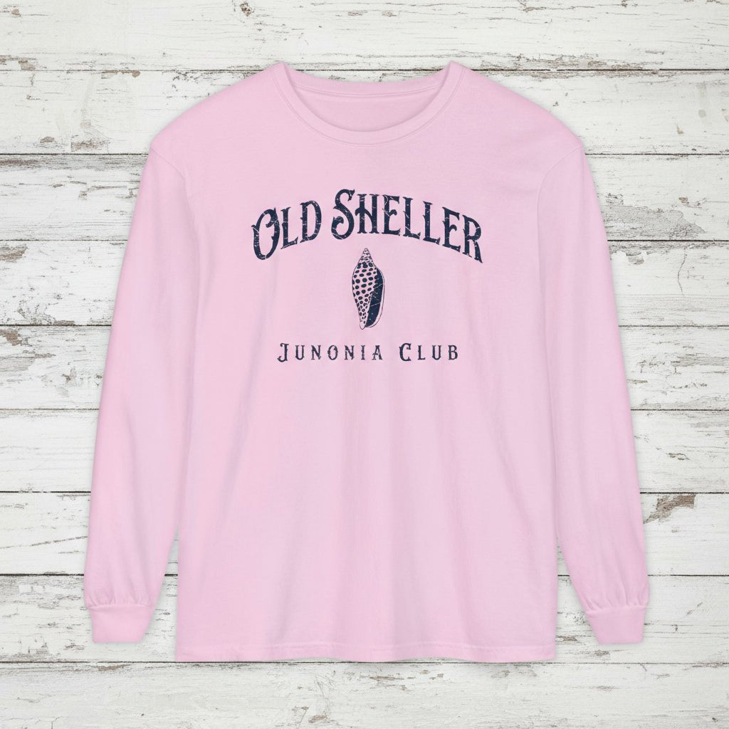 Pink long-sleeve shirt with 'Old Sheller Junonia Club' text and shell graphic on a white background