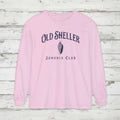 Pink long-sleeve shirt with 'Old Sheller Junonia Club' text and shell graphic on a white background