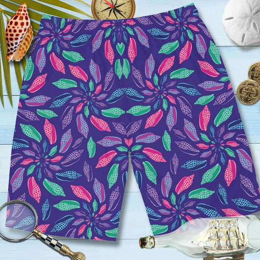 Back of Men's Boardshorts lying on nautical wood along with a compass, a sand dollar, 2 gold coins, a ship in a bottle, a magnifying glass and a Junonia.