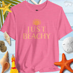 Just Beachy Bella T-Shirt in Tropical Colors displayed with seashells, sun, and beach decor for a summery vibe.