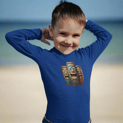 Child wearing a royal blue shirt with laughing tiki bongos design on the beach