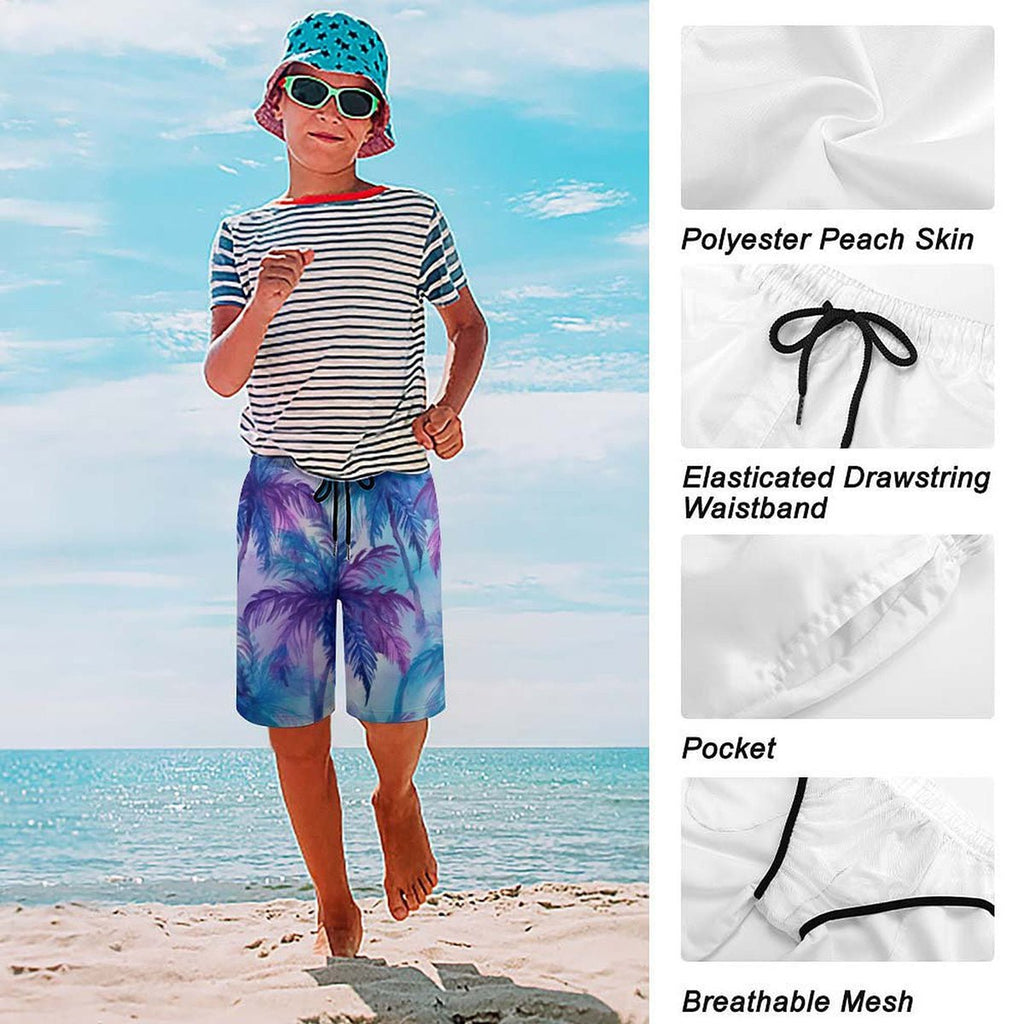 Child wearing a striped shirt and colorful shorts on a beach with fabric details shown.