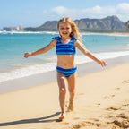 Girl in Blue and white striped bikini set on a Hawaiian Island beach