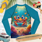 Children's blue rash guard shirt with a cartoon crab design on a beach background with flip-flops and a toy van.