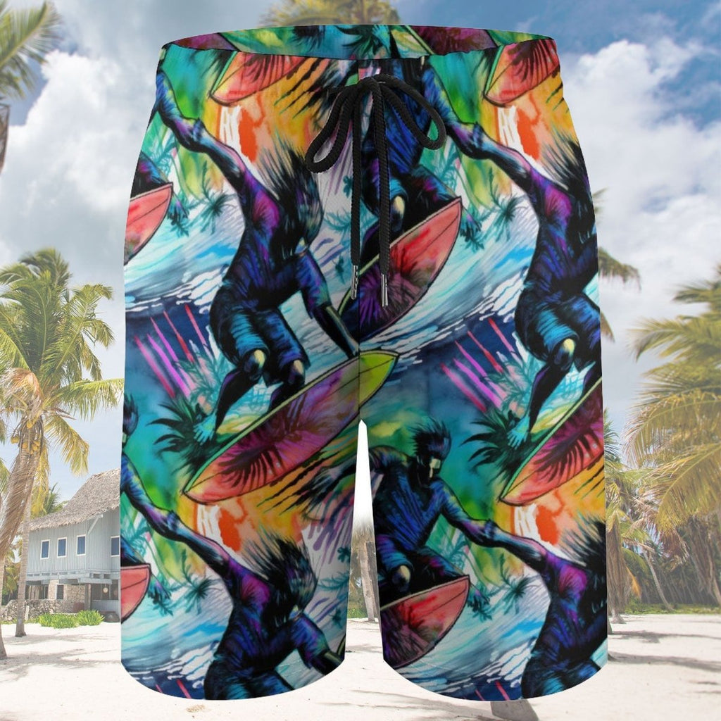 Colorful beach shorts with a tropical design featuring people on surfboards against a palm tree background.