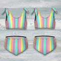 Pastel striped bikini set with bow details on a rustic nautical wood background