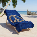 large beach towel laid across a chair on the beach under a palm tree