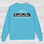 Blue sweatshirt with text on the back on a wooden surface