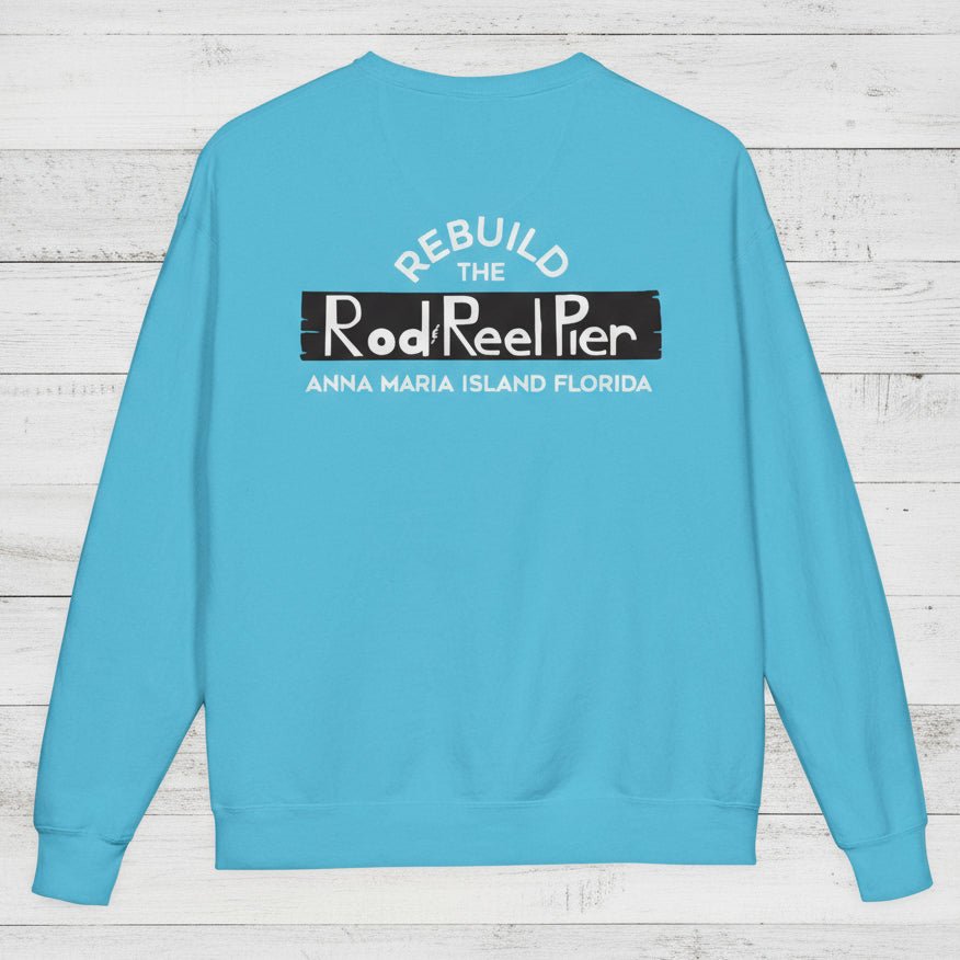 Blue sweatshirt with text on the back on a wooden surface