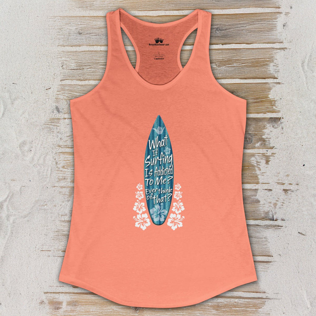 Coral tank top with a graphic design on a wooden surface