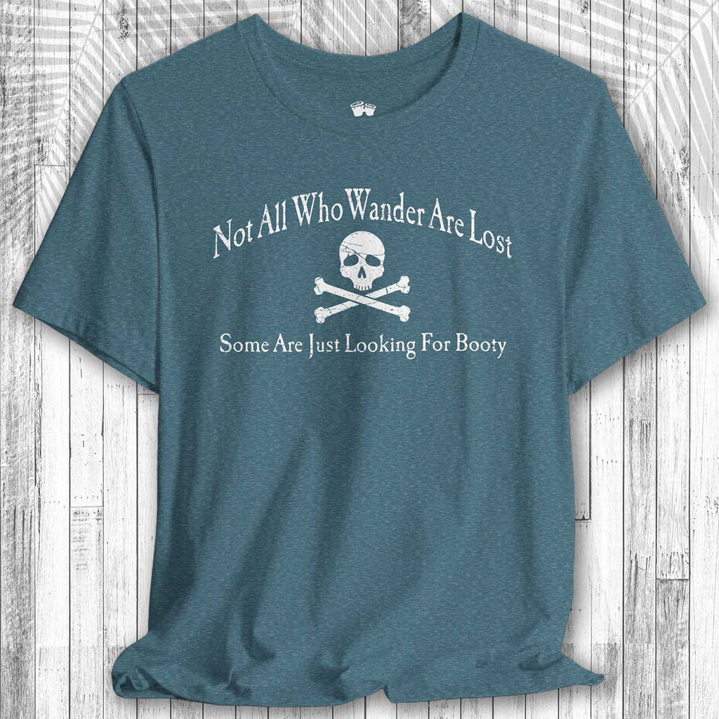 Blue t-shirt with skull and crossbones design and text on a wooden surface