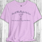 Purple Parrot Head Adventure Shirt with humorous text and graphic on a wooden surface