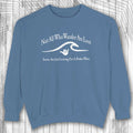 Blue shaka inspired sweatshirt with white text and graphic on a wooden surface