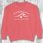 Red shaka inspired sweatshirt with white text and graphic on a wooden background