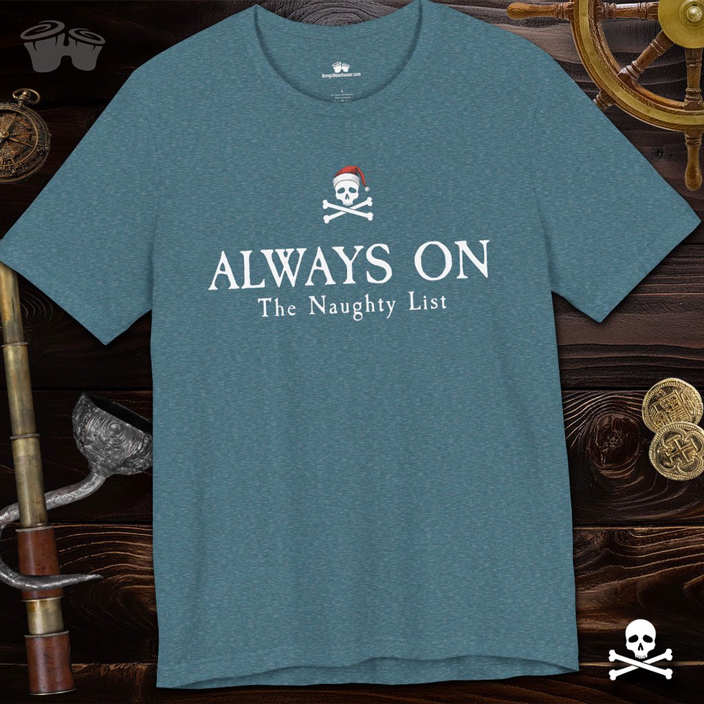 Teal t-shirt with pirate-themed text on a wooden background with ship decor