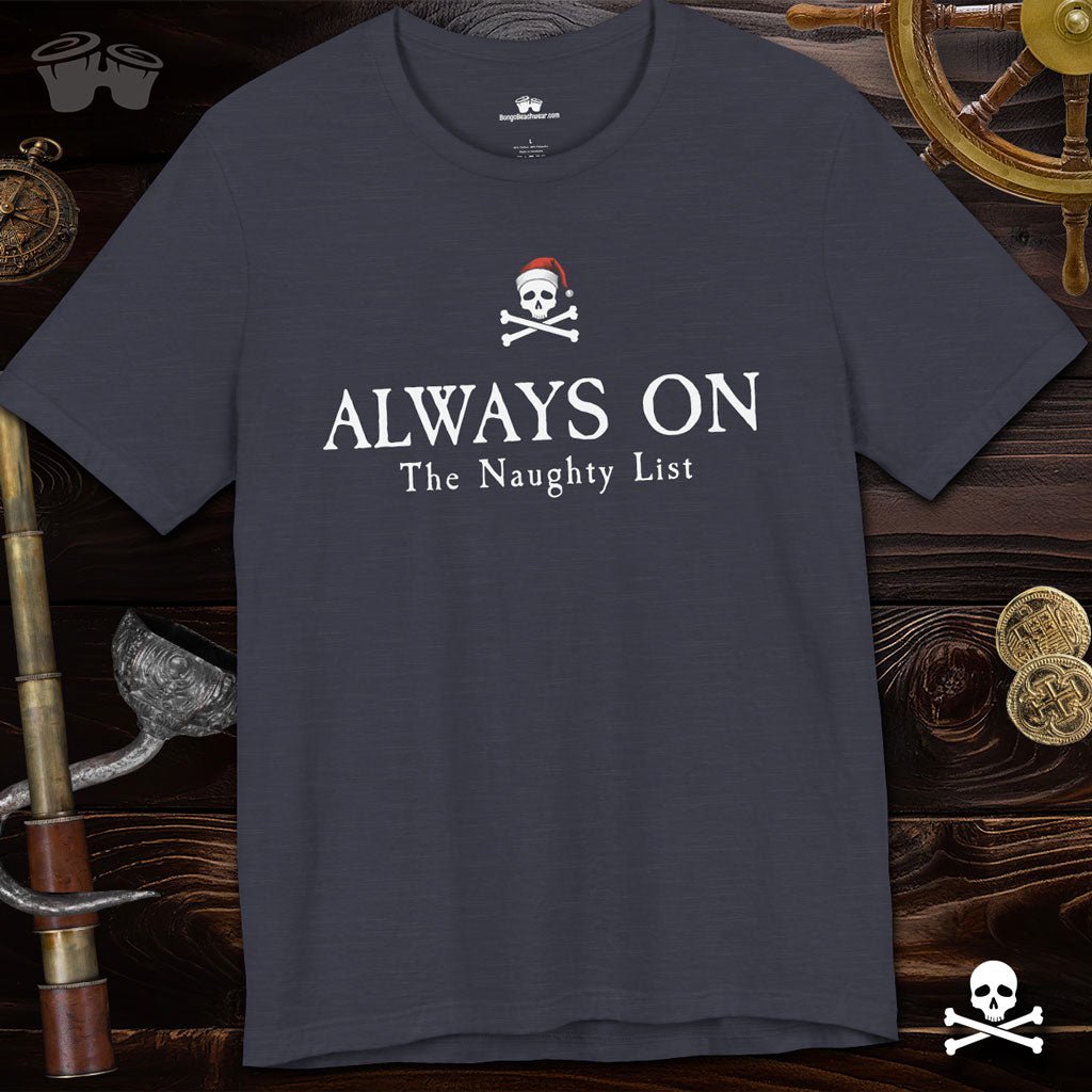 Navy blue t-shirt with pirate-themed text on a wooden background with ship elements.