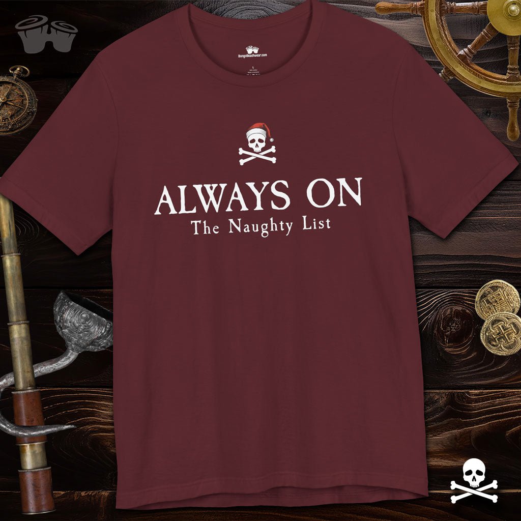 Maroon t-shirt with 'Always On The Naughty List' text and skull design on a pirate-themed background.