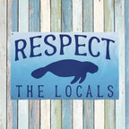 Blue sign with text 'RESPECT THE LOCALS' and a silhouette of a beaver on a wooden background.