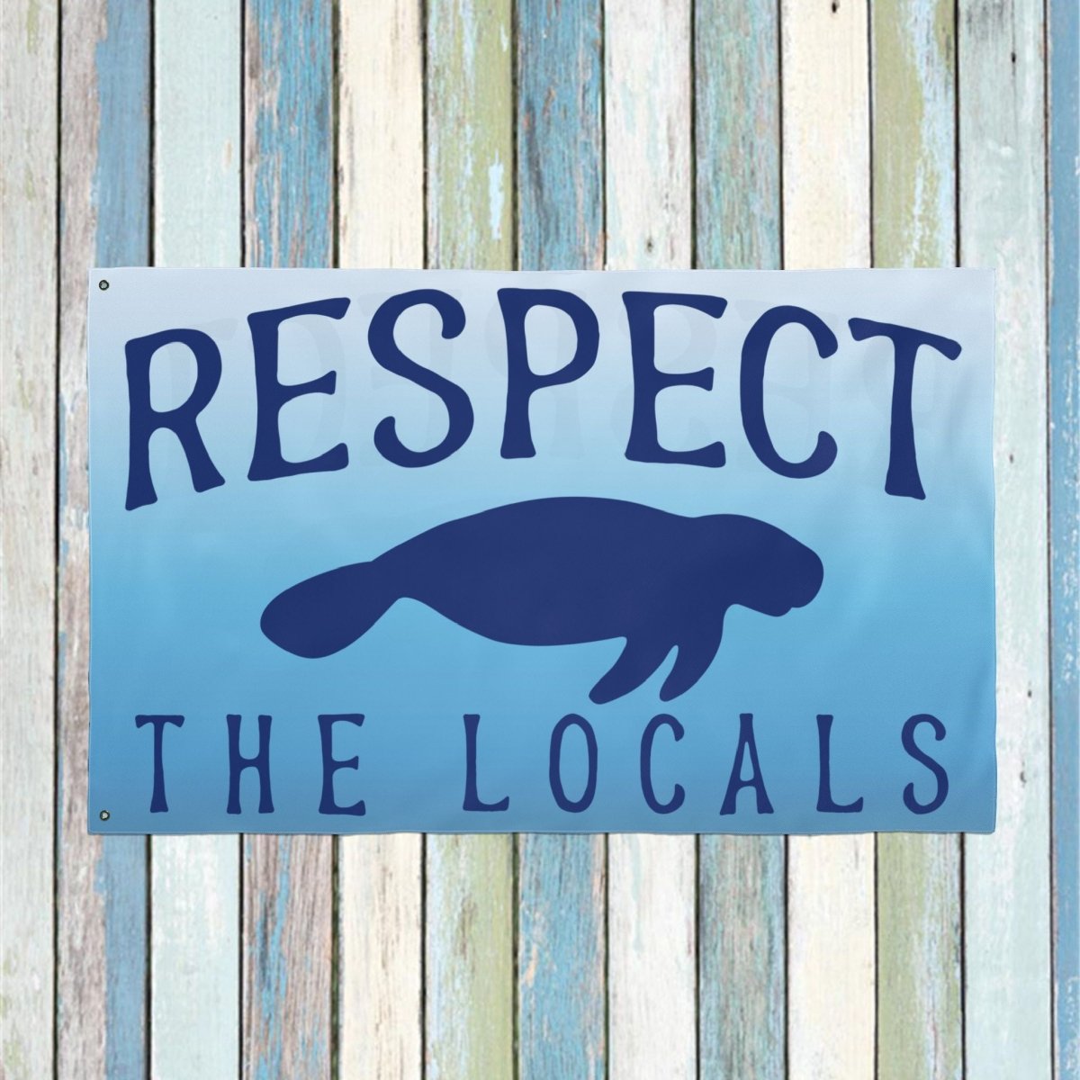 Blue sign with text 'RESPECT THE LOCALS' and a silhouette of a beaver on a wooden background.