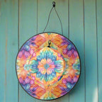 Colorful tie-dye patterned hat with a string on a white background