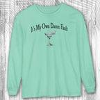 Island Reef green long-sleeve margarita tee shirt with a graphic and text on a wooden background