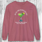 Maroon long-sleeve shirt with a graphic of a margarita and text on a wooden surface