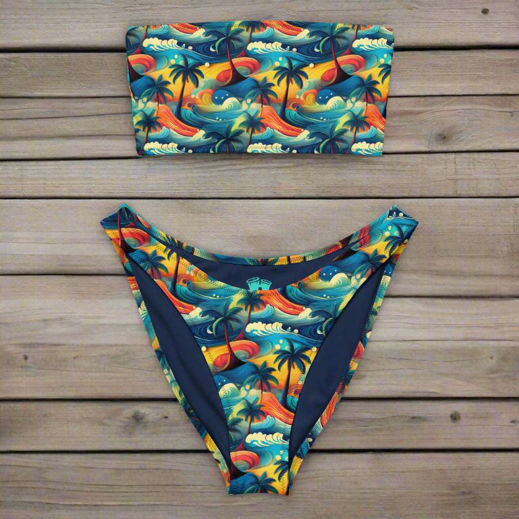 The Island dream maui bandeau bikini laying on teal painted deck of a vintage sailboat.
