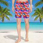 Dude on a beach wearing Colorful tropical patterned shorts